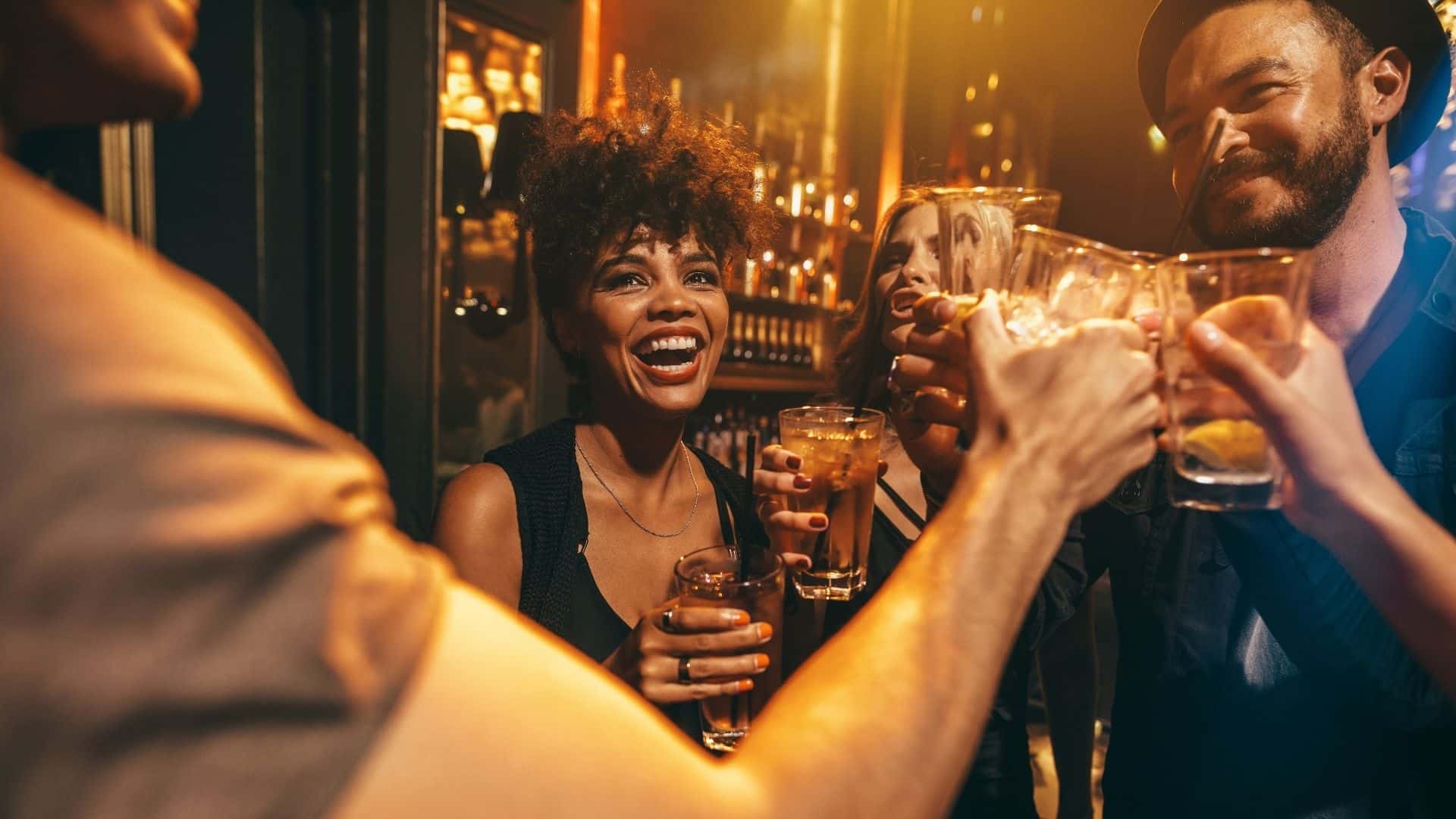 people mingling and drinking at a cocktail lounge