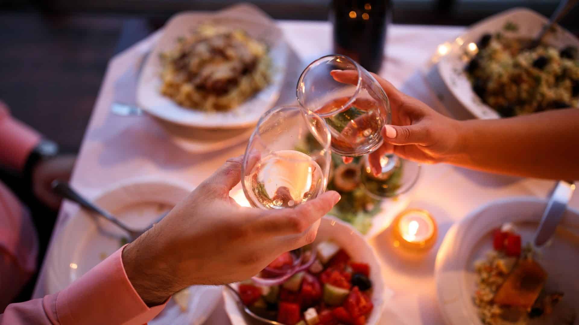 couple having a romantic candle-lit dinner with wine